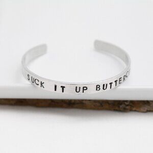 Suck It Up Buttercup - Hand Stamped Anodized Aluminum Bangle - Adjustable